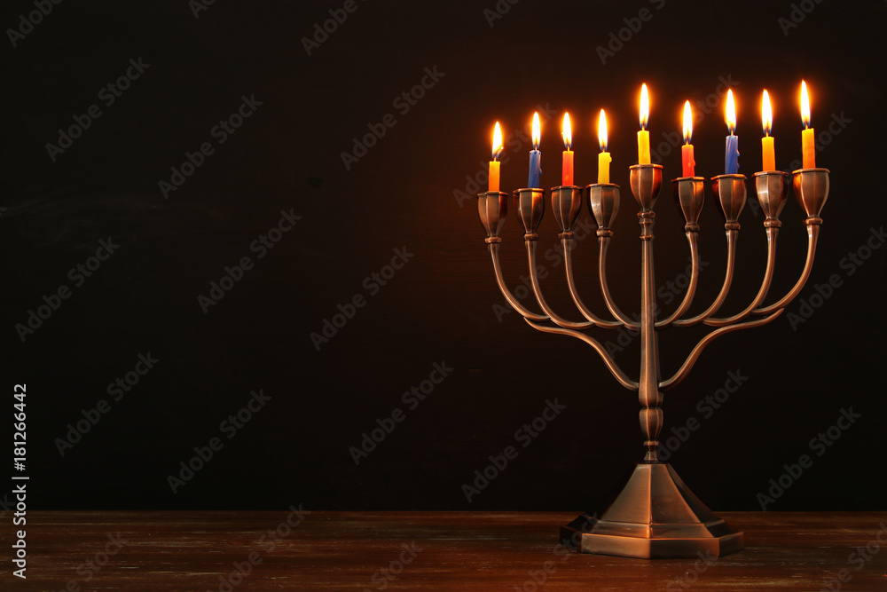 jewish holiday Hanukkah background with menorah (traditional candelabra) and burning candles jewish holiday Hanukkah background with menorah (traditional candelabra) and burning candles
