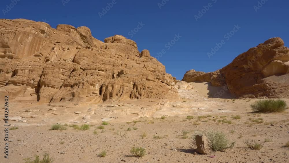 View of the sand dunes and mountain. Desert at sunset - mountain landscape with dust. View of the sand dunes and mountain. Desert at sunset - mountain landscape with dust.