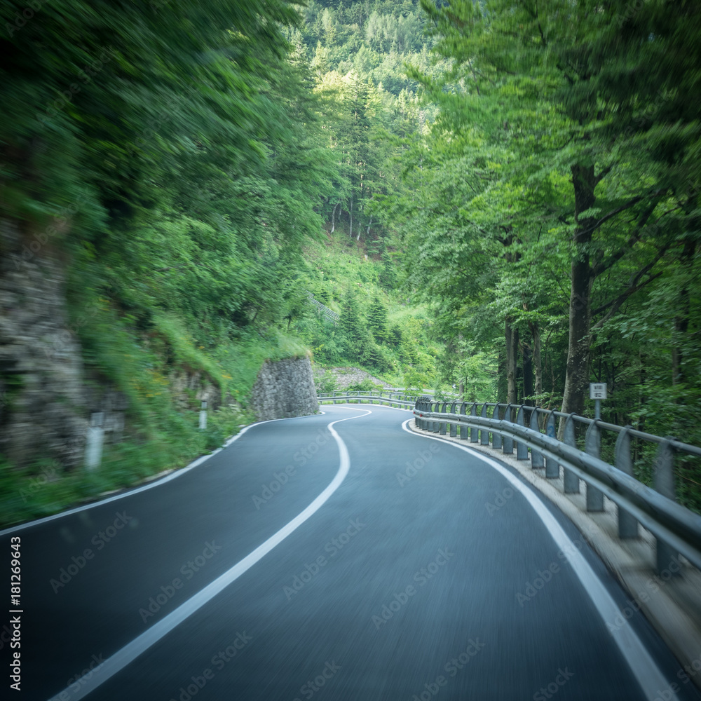 Driving downhill through switchbacks in the Alps Driving downhill through switchbacks in the Alps
