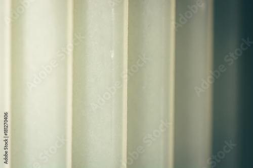 Plastic striped surface with vertical lines.