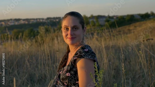 young girl sending air kiss and a smile