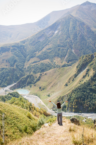 woman admires the view of the mountains