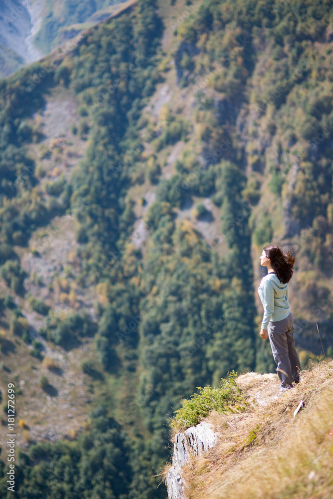 woman admires the view of the mountains