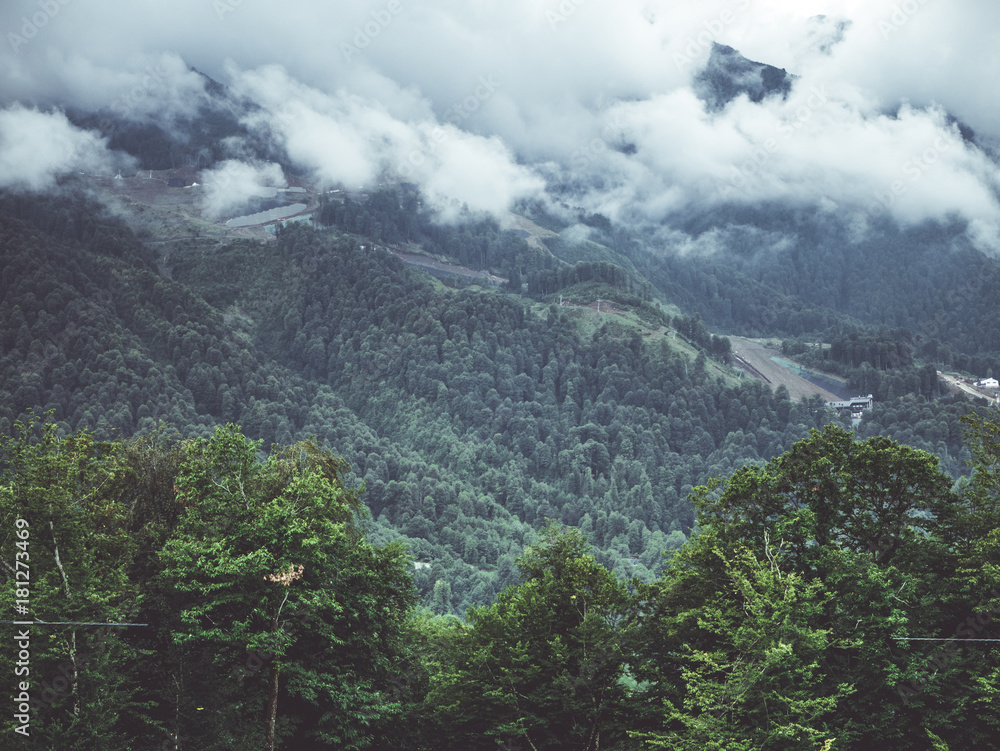 Naklejka premium clouds above the mountain forest tropic foggy