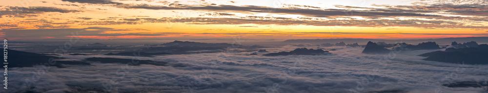 Panoramic of the rainy season with foggy at morning, Mountain top view of sunrise landscape in the rainforest, Thailand