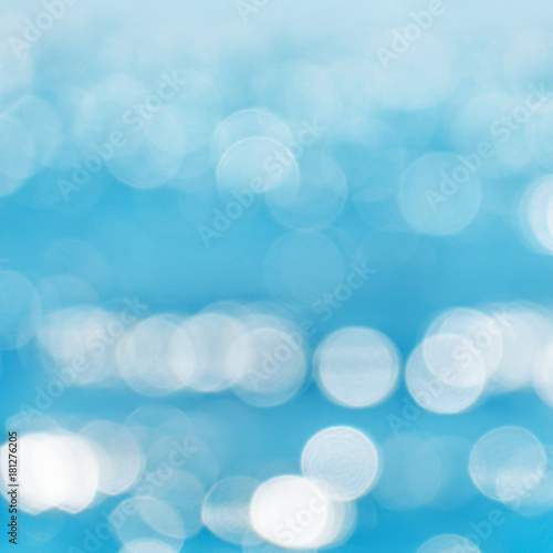 Sea blurred bokeh background with patches of light