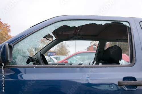 Broken side window glass on the damaged car door  © Srdjan