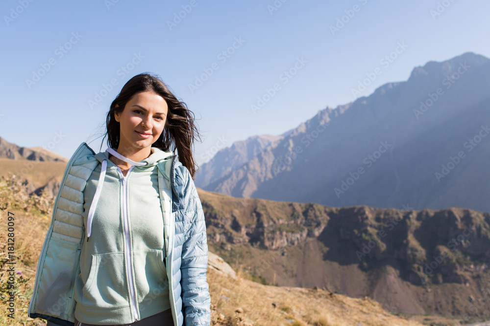 girl admires a view of the Kazbek mountain