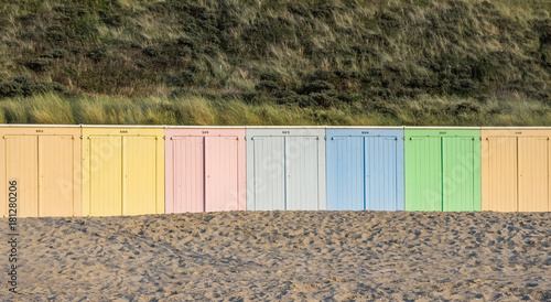 Pastel coloured beach cabins on the beach of Domburg photo