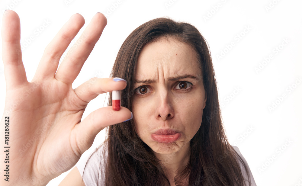 Health, woman sick, woman with pill, woman on isolated background portrait Health, woman sick, woman with pill, woman on isolated background portrait