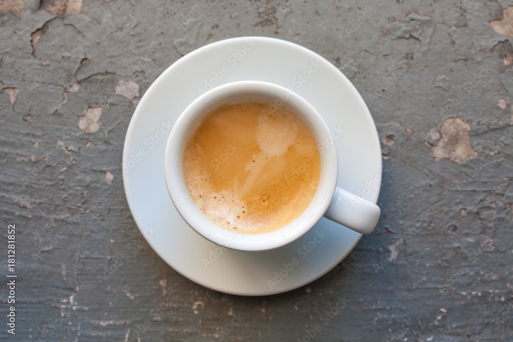 Cup of coffee espresso, top view on grey grunge background Cup of coffee espresso, top view on grey grunge background