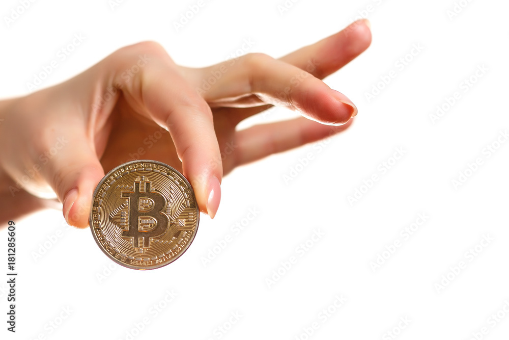 Fototapeta premium Isolated of hand putting a bitcoin concept human hand with bitcoin hand with bitcoin