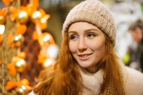 portrait of a beautiful red-haired girl at christmas time