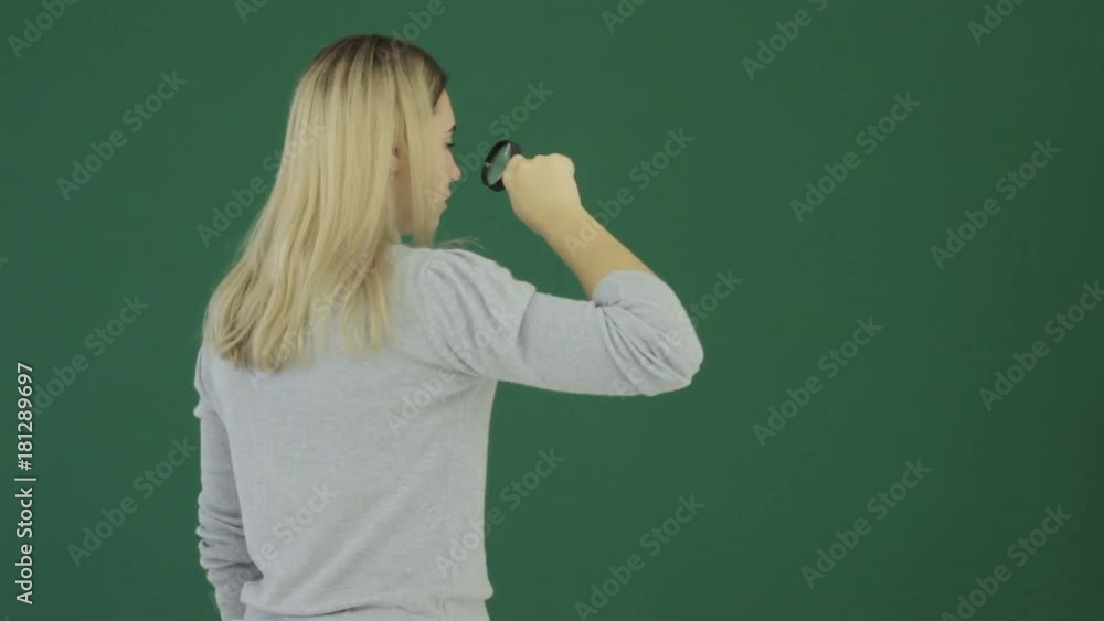 Young pretty girl with loupe, chromakey Young pretty girl with loupe, chromakey