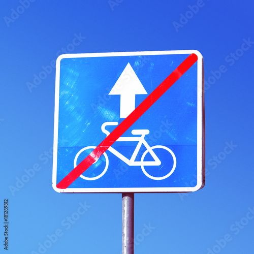 No bikes sign. Traffic Sign do not cycling on the pillar photo