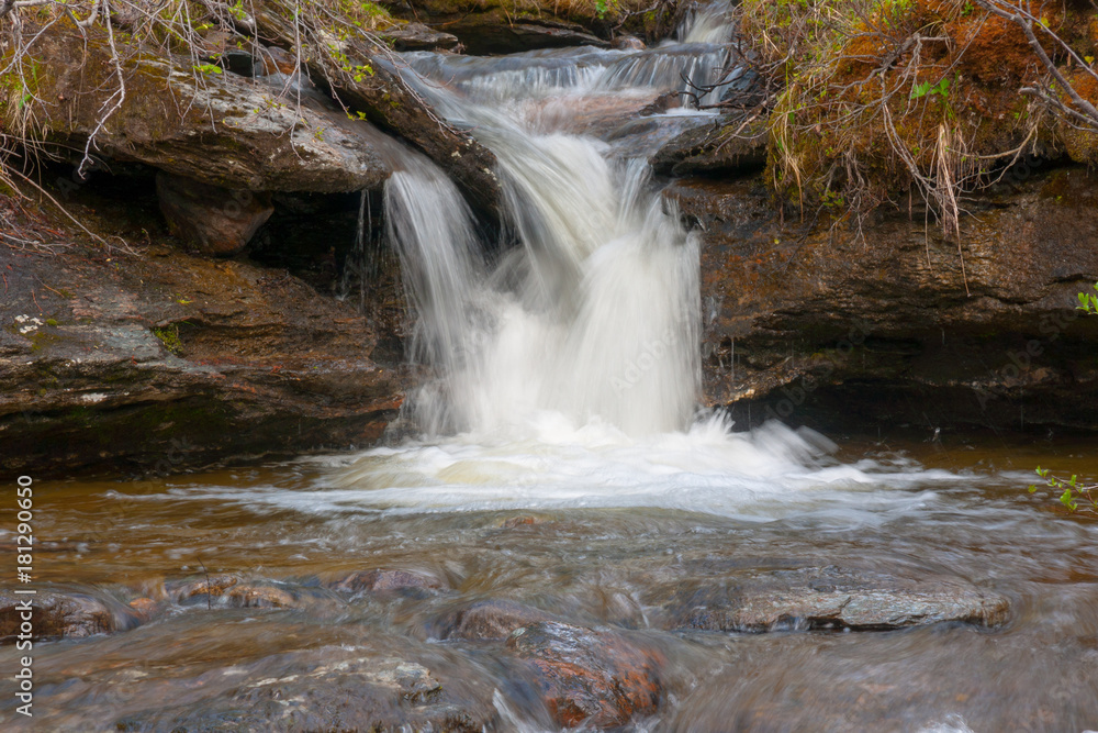 Fototapeta premium Small waterfall in mountains of northern Norway