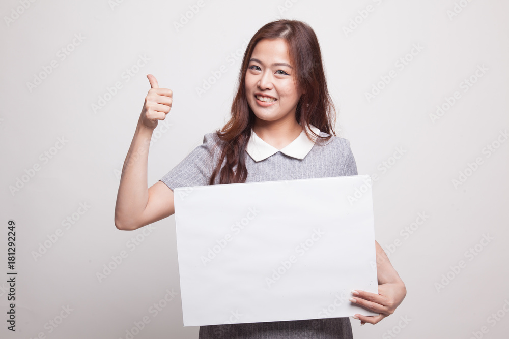 Young Asian woman show thumbs up with white blank sign. Young Asian woman show thumbs up with white blank sign.