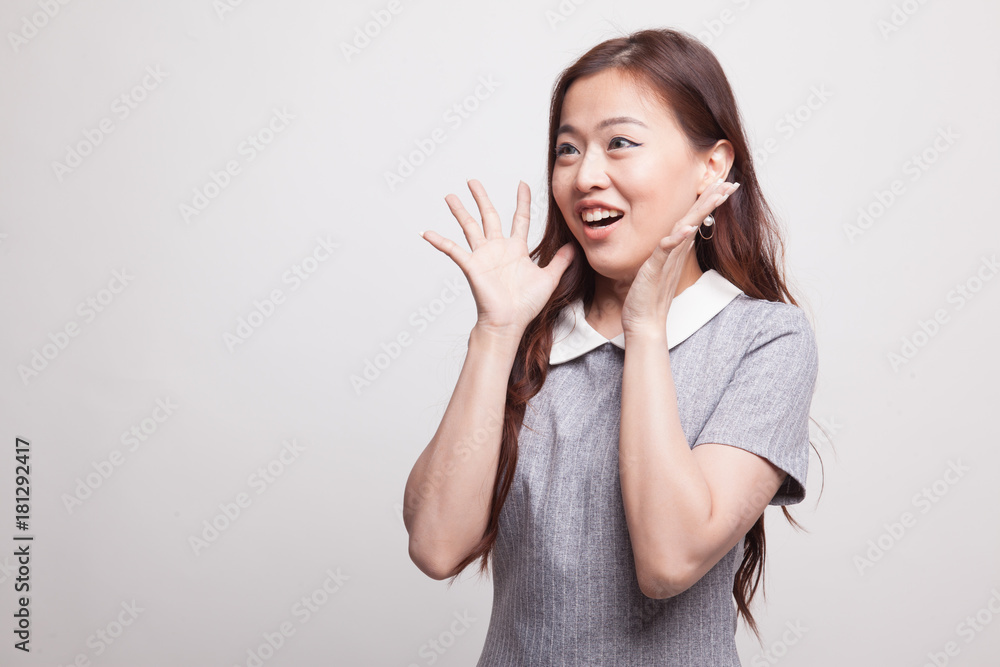 Young Asian woman is surprised and smile. Young Asian woman is surprised and smile.
