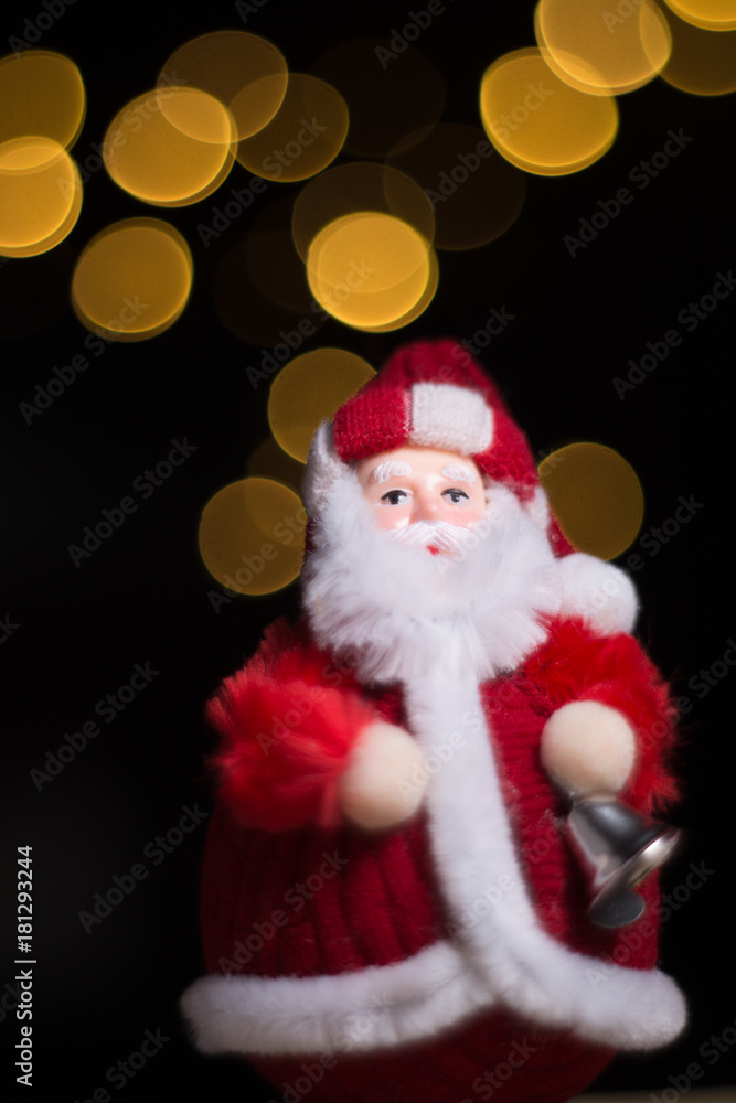 Santa Claus holding bell, Christmas theme, black background with bokeh lights, copy space Santa Claus holding bell, Christmas theme, black background with bokeh lights, copy space