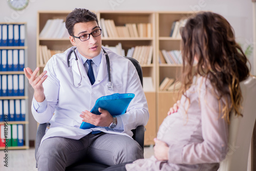 Pregnant woman visiting doctor for consultation