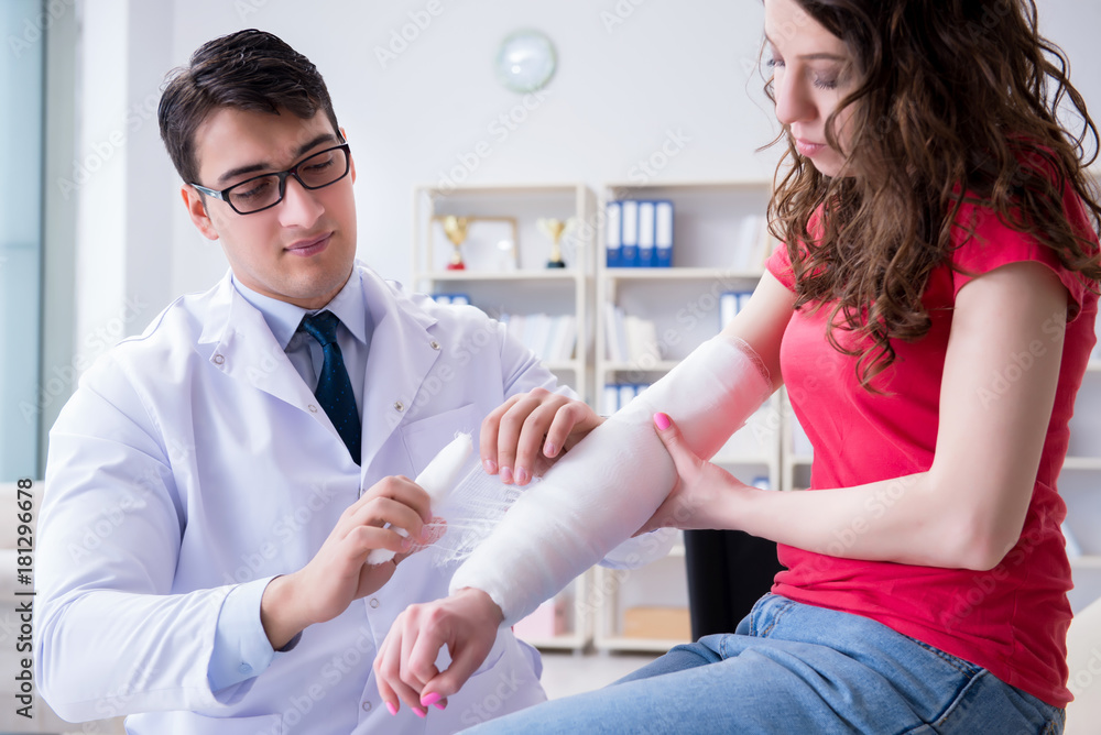 Fototapeta premium Doctor and patient during check-up for injury in hospital