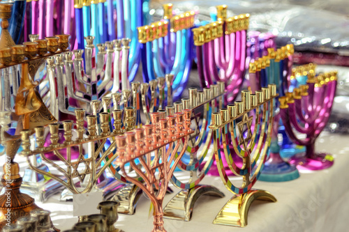 Menorah of Hanukkah (traditional candelabra) at the stand of a gift shop, Netanya, Israel. Jewish traditions and holidays.