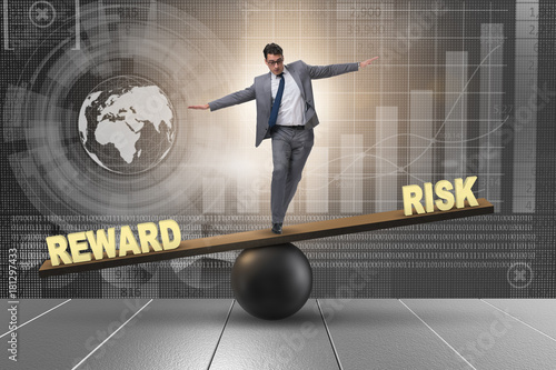 Fotografie Businessman balancing between reward and risk business concept