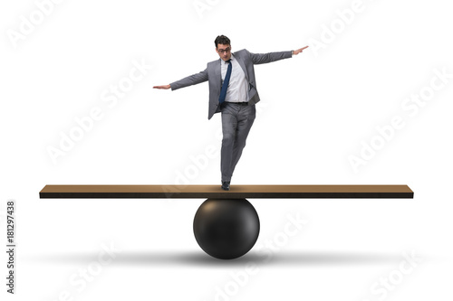 Картината върху платно Businessman balancing on seesaw in uncertainty concept