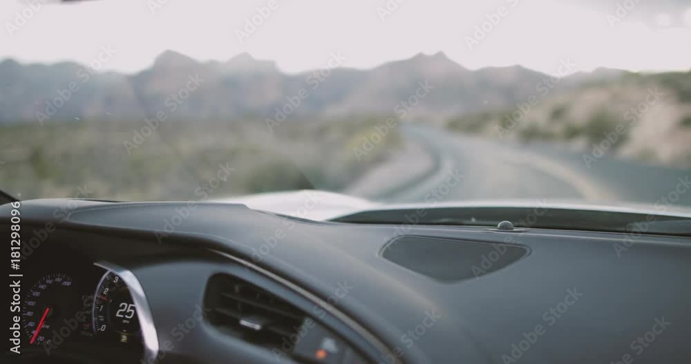 Female driving convertible car on roadtrip Female driving convertible car on roadtrip