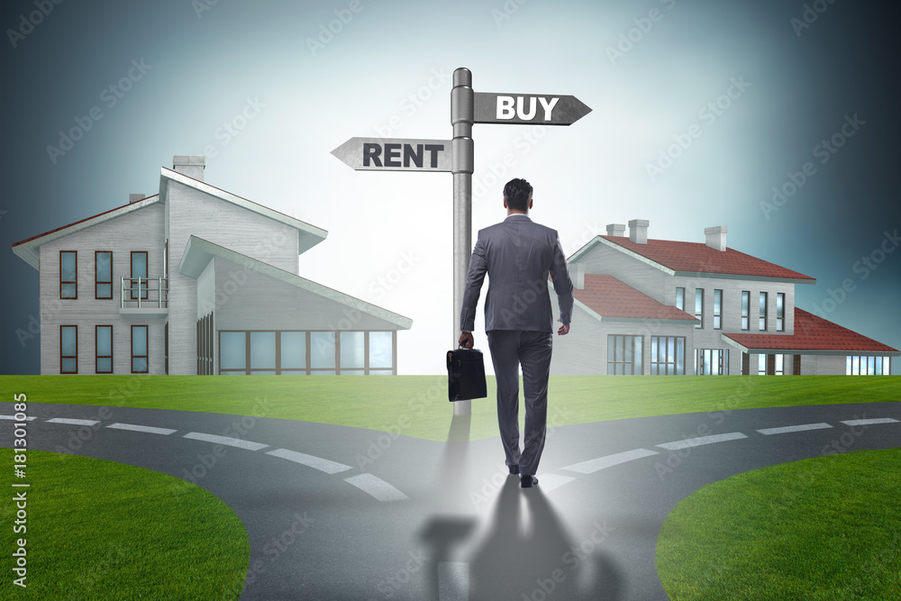 Businessman at crossroads betweem buying and renting Businessman at crossroads betweem buying and renting