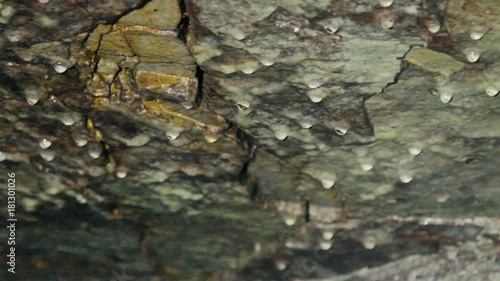 Caving, spelaeology, spelunking. Karst cave, dripstone, sinter, speleothem, dropstone. Initial stage of formation of stalactite.
 photo