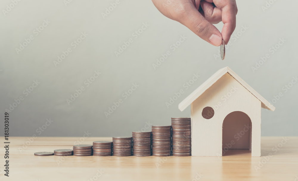 Αυτοκόλλητο Property investment and house mortgage financial concept, Hand putting money coi