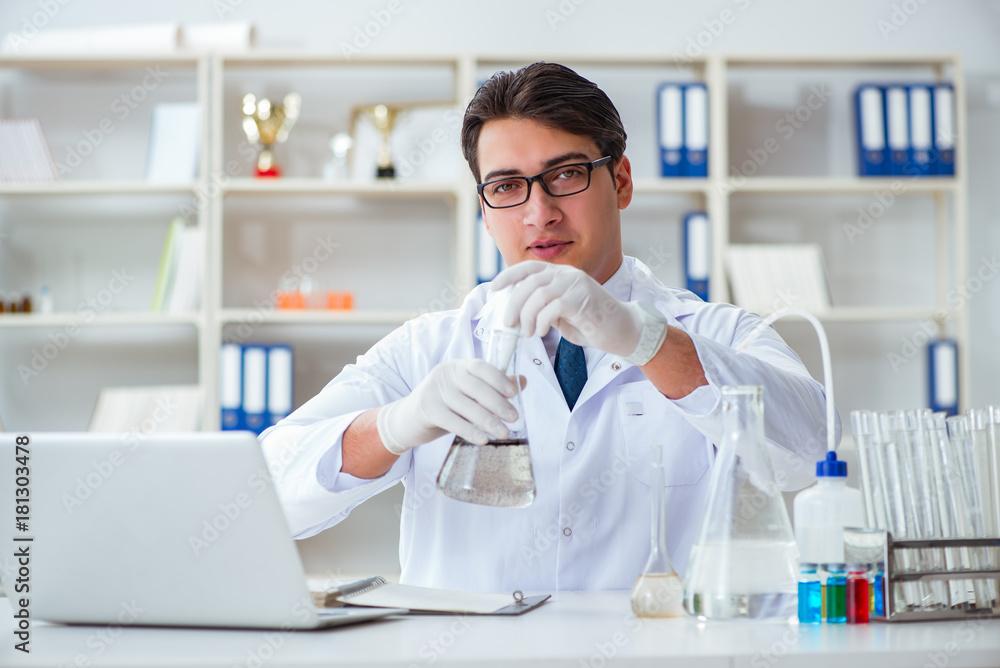 Young researcher scientist doing a water test contamination expe Young researcher scientist doing a water test contamination expe