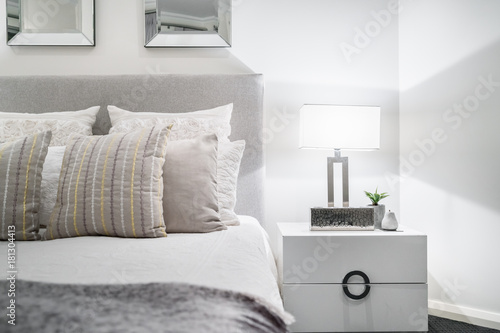 Bedroom setting with lampshade and light coloured decor in a modern Australian home.