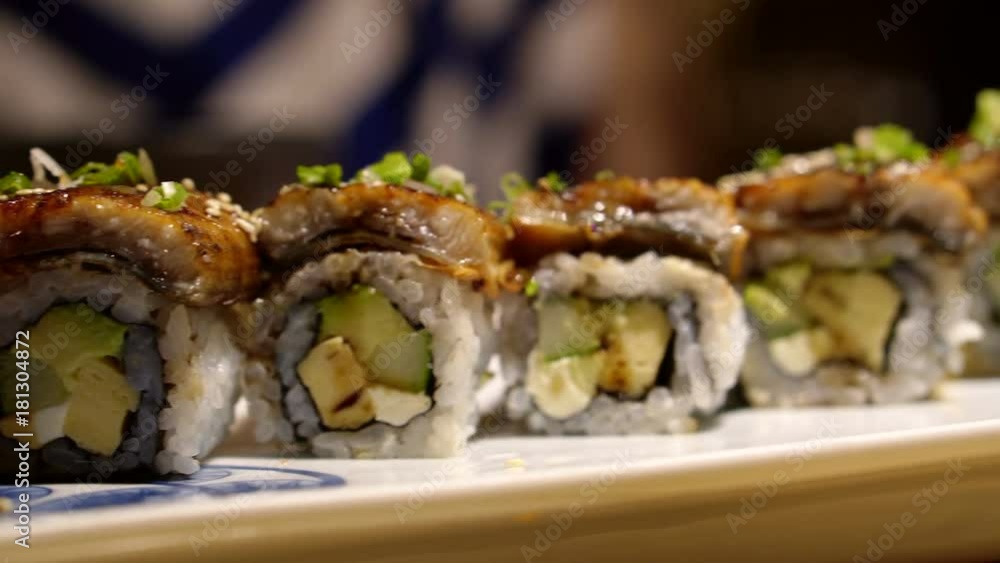 Unagi Eel Avocado Cheese Maki sushi roll 4K Unagi Eel Avocado Cheese Maki sushi roll 4K