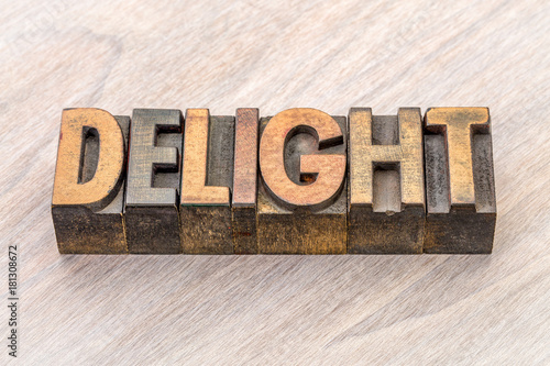 delight word abstract in wood type