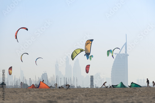 Kite surf kites flying over Jumeirah public beach in Dubai, UAE.