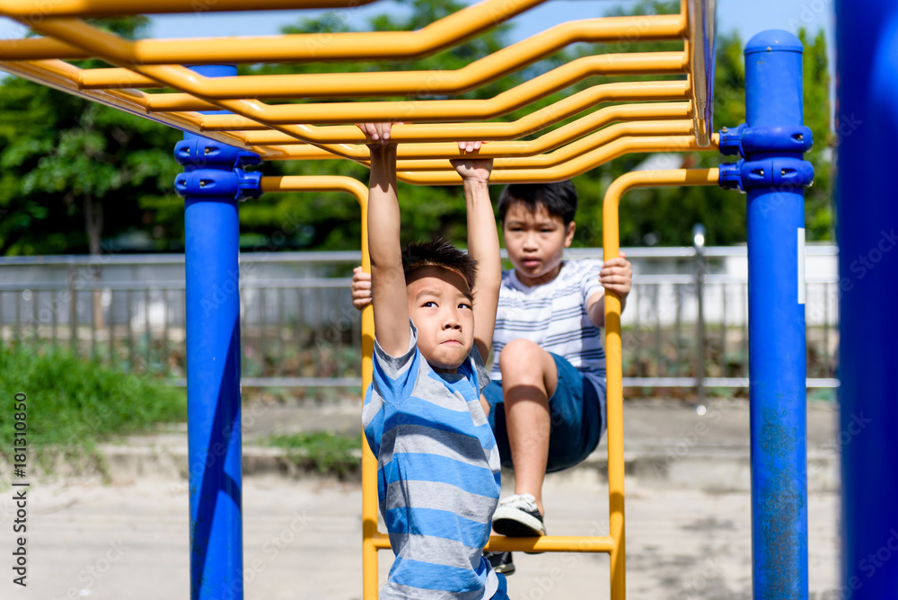 Fototapeta premium Young asian boy hang out door playground