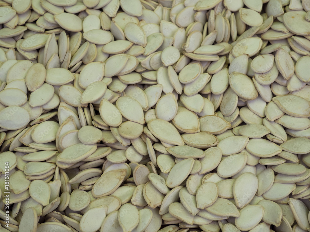 Detail of pumpkin seeds background. A healthy natural plant food is useful for digestion. Detail of pumpkin seeds background. A healthy natural plant food is useful for digestion.