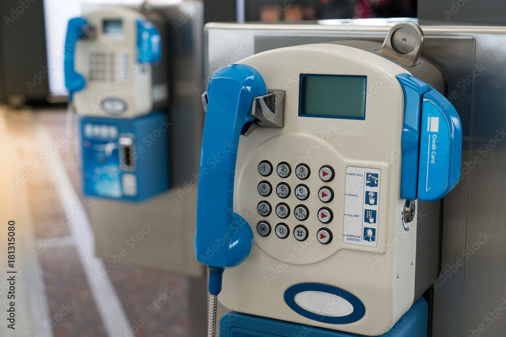 Public payphone telephone inside the international airport. Public telephone corner for passenger or traveler. Public payphone telephone inside the international airport. Public telephone corner for passenger or traveler.