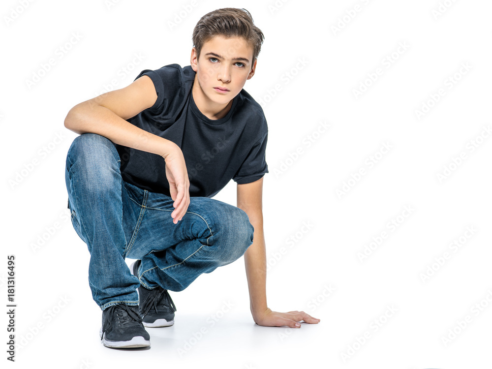 Photo of teenage handsome guy posing at studio Photo of teenage handsome guy posing at studio