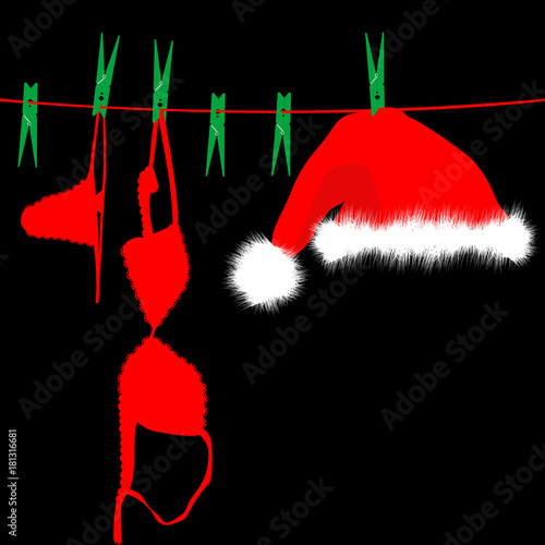 Hanging red underwear and Santa Claus hat on clothesline