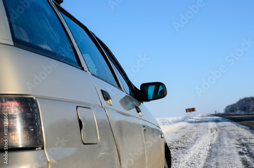 Car on a roadside on winter © ihorbondarenko