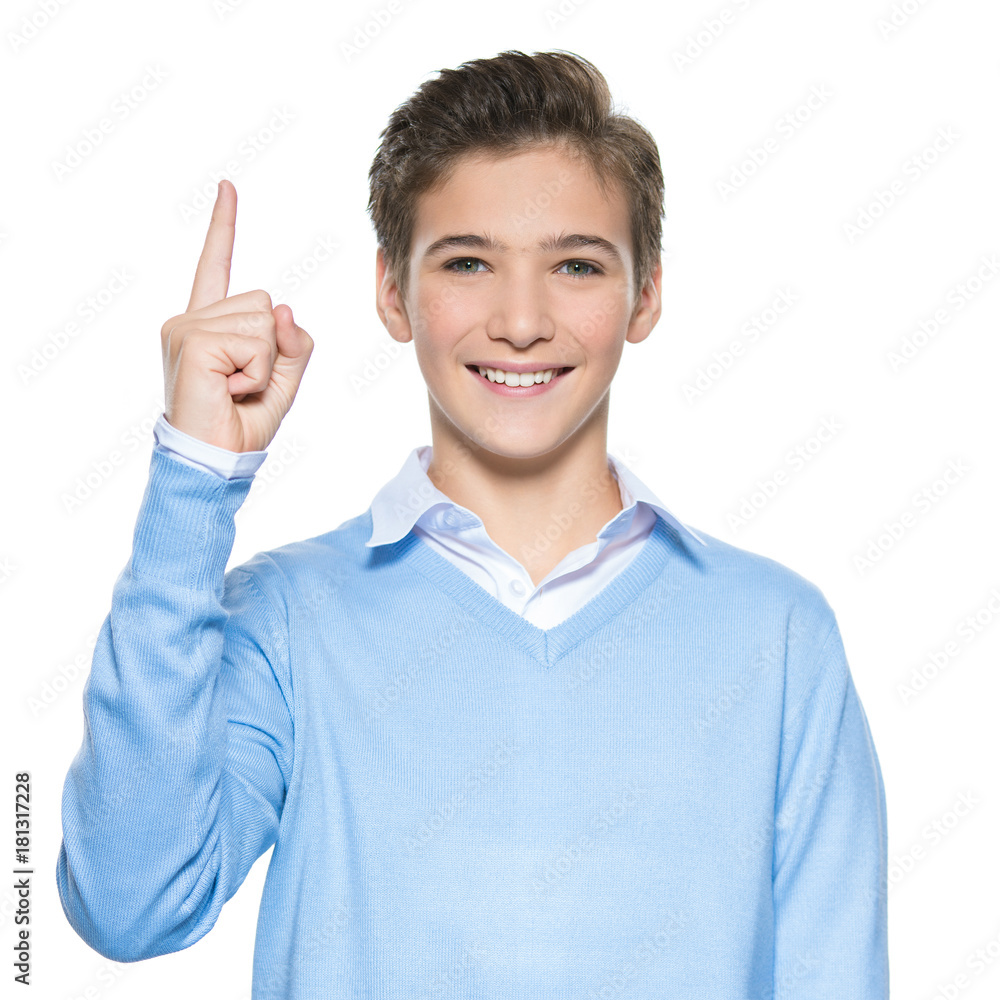 Young guy points up by finger Young guy points up by finger