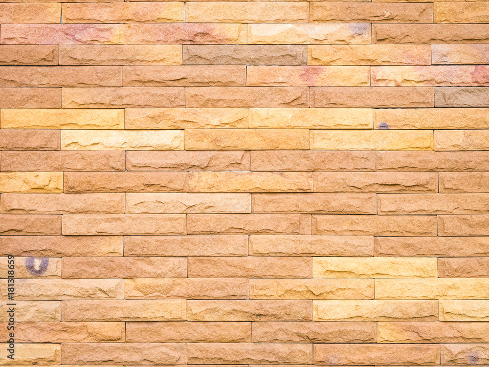 Obraz premium Brown stone brick wall background.