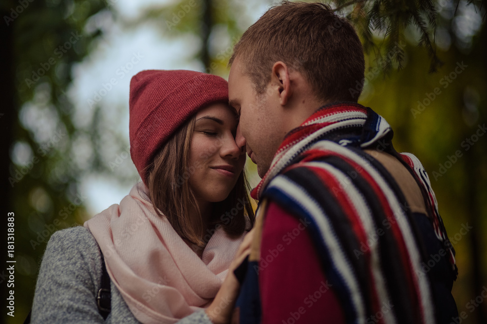 Fototapeta premium Beautiful pair of lovers walking in the autumn Park