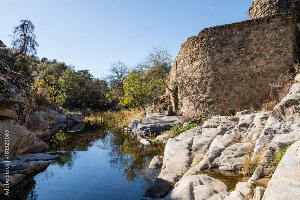 Water from the Perales River, in the mountains of Madrid, eroding the granite rocks