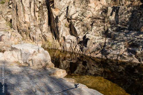 Water from the Perales River  in the mountains of Madrid  eroding the granite rocks