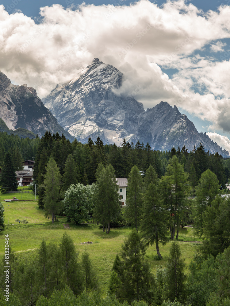 Mountain Ridge in Italian Dolomites Alps, Trees and Typical Houses in Summer Time