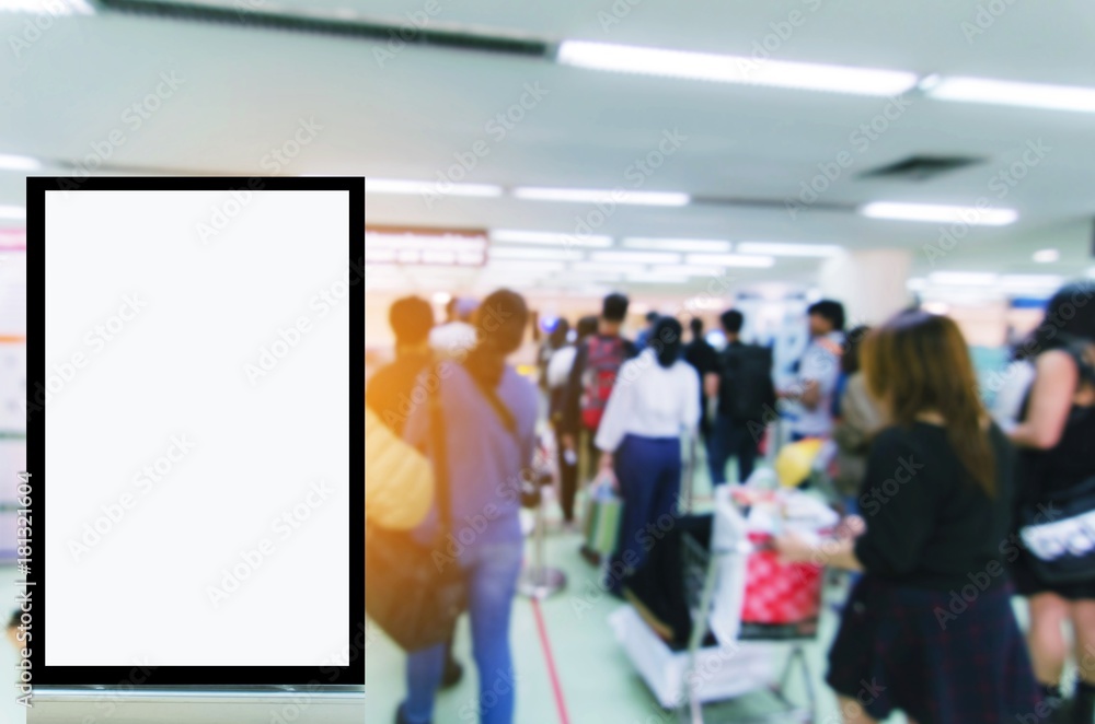 blank advertising billboard or showcase light box with copy space for your text message or media content with people queue at immigration control at airport, commercial and marketing concept